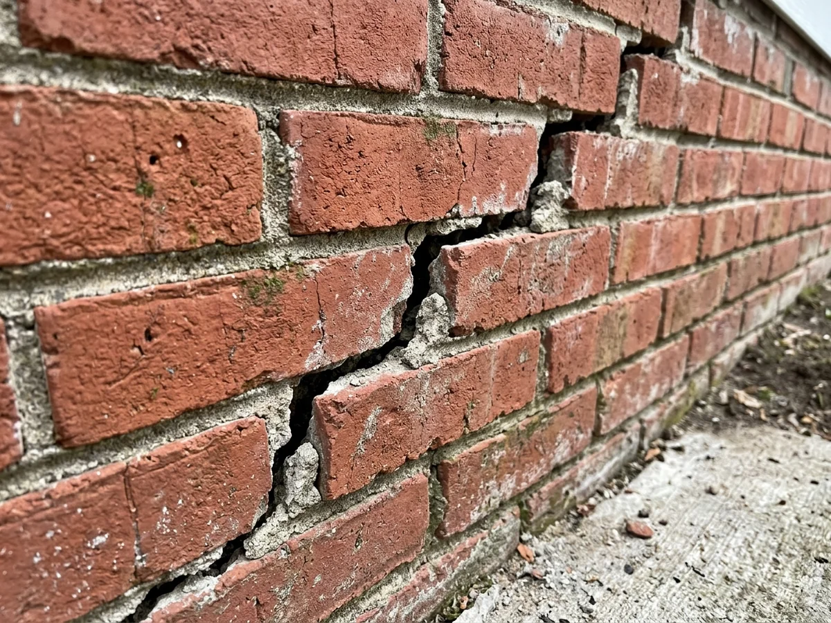 Stair-step crack in a brick foundation wall